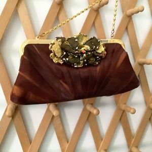 Evening purse  gold tone chain interesting embellishment .